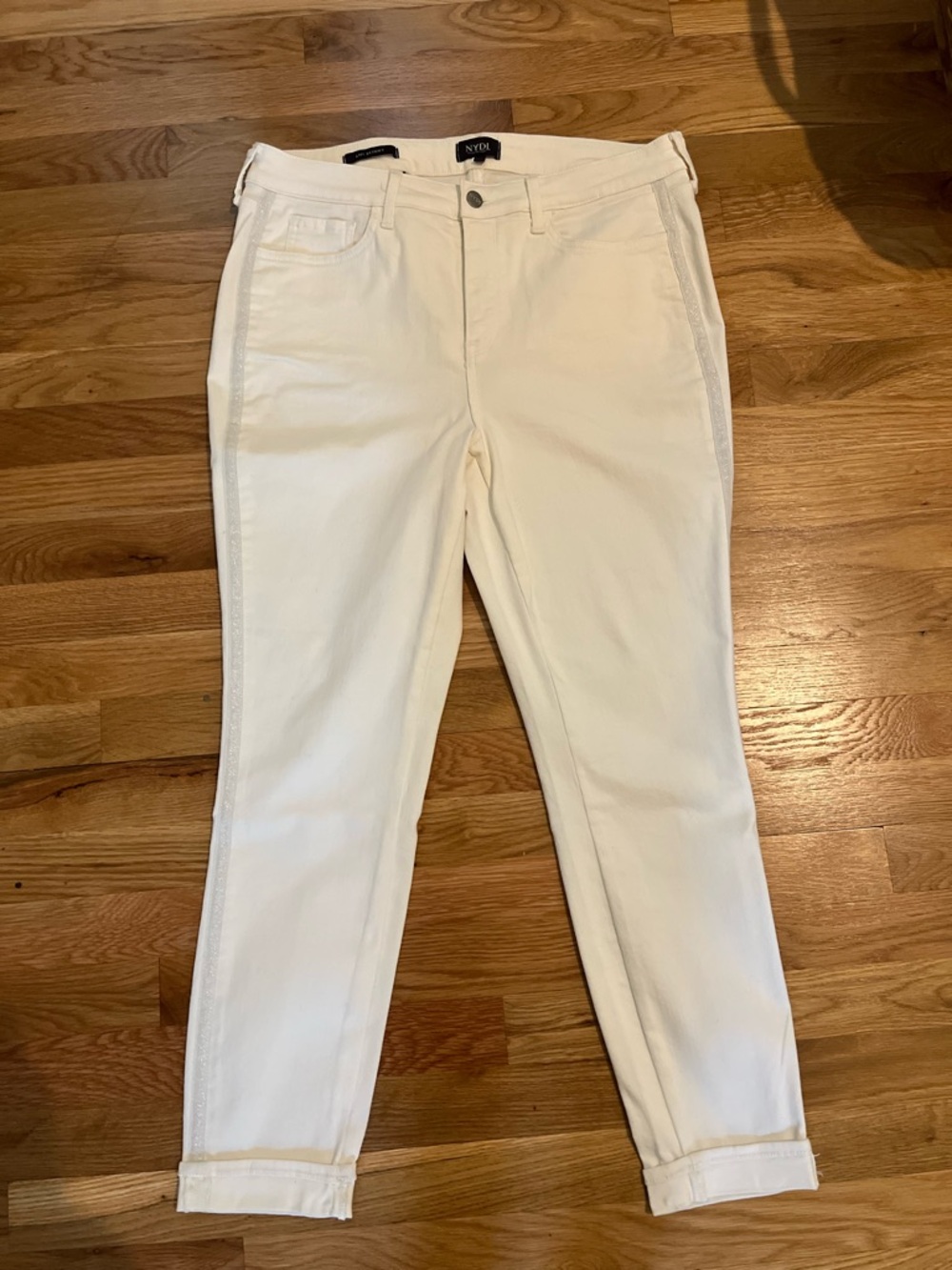 NYDJ White Ami Skinny Jeans with Button Detail and glittery side.